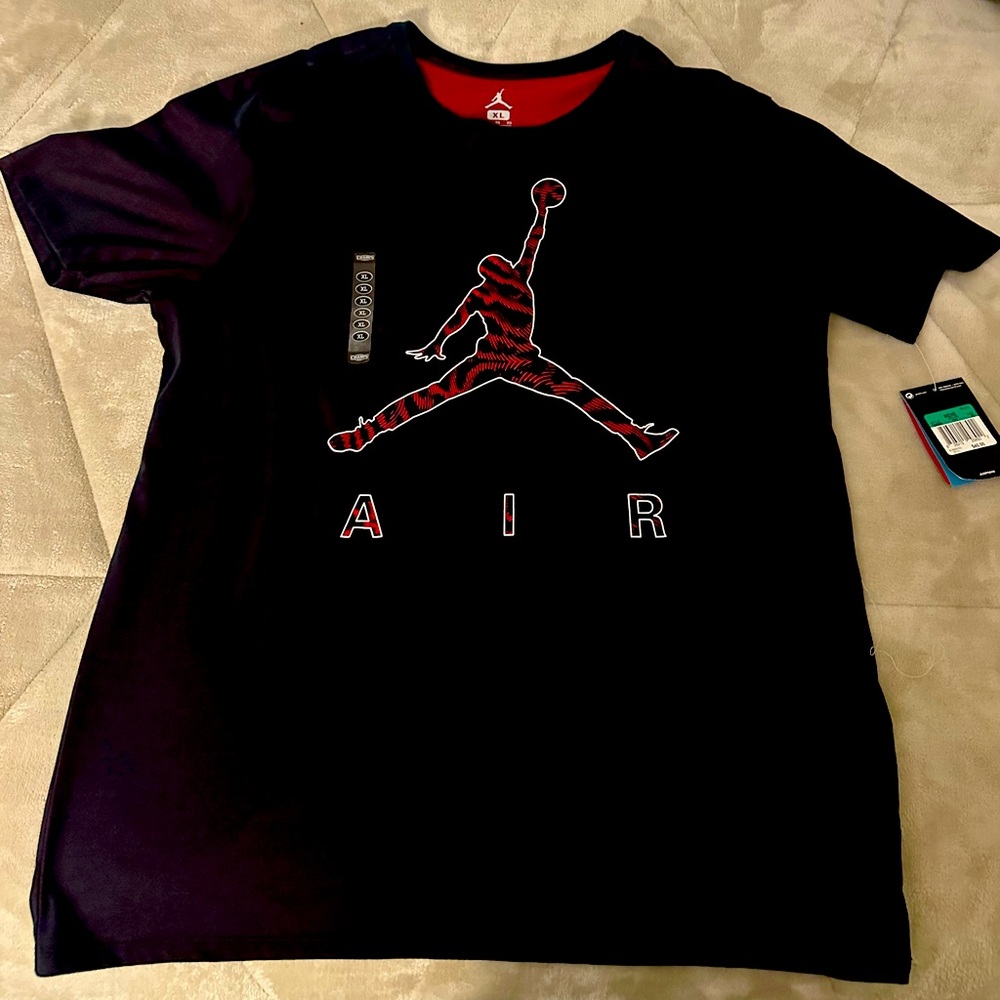 Jordan brand nike. Dri fit this is a unique shirt with red inside.